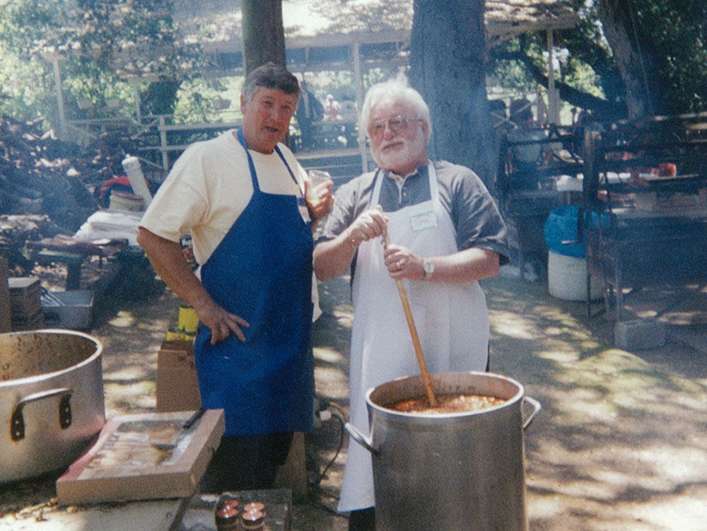 two men making chili